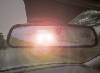 Headlight glare in rear view mirror. Night vision loss.