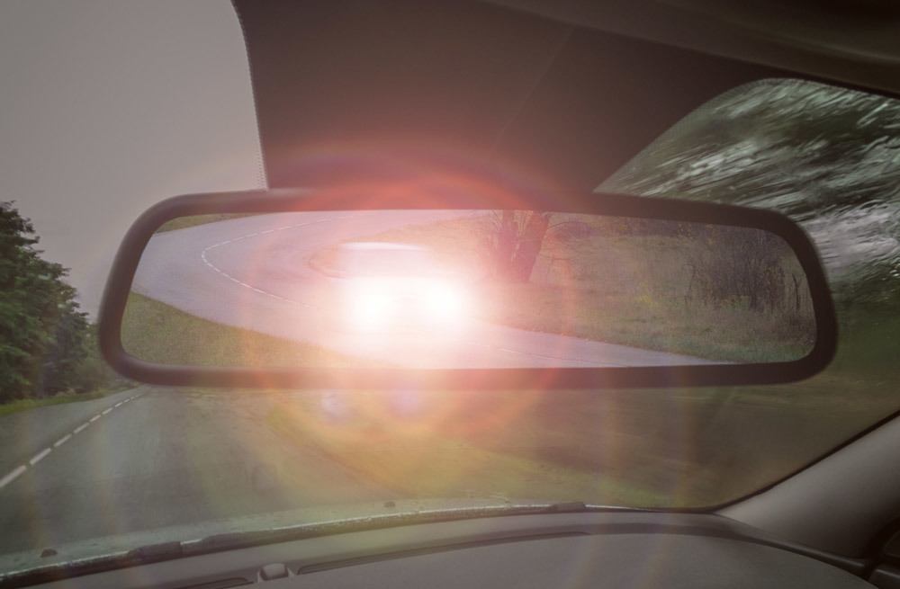 Headlight glare in rear view mirror. Night vision loss.