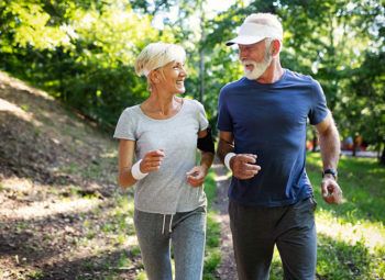 older couple jogging outdoors