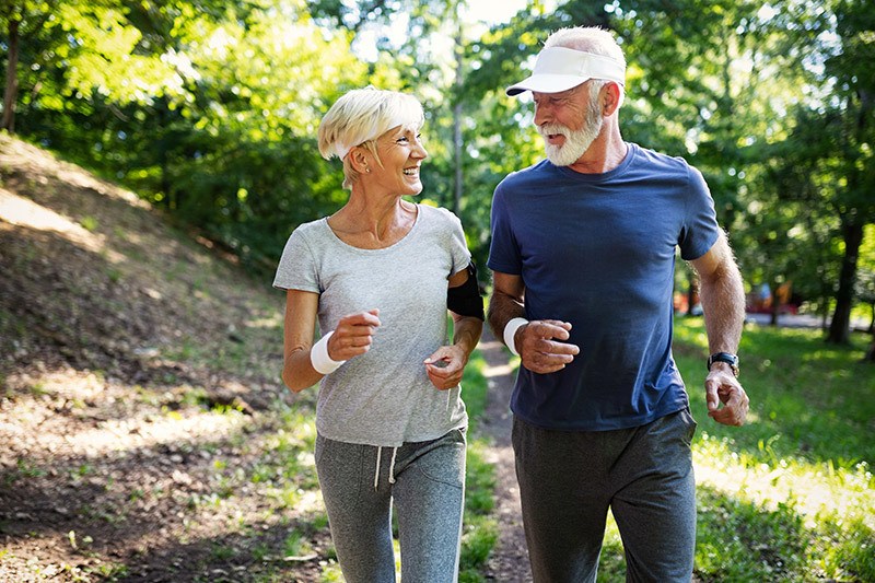older couple jogging outdoors