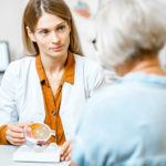 senior women speaking with eye doctor during a cataract surgery consultation