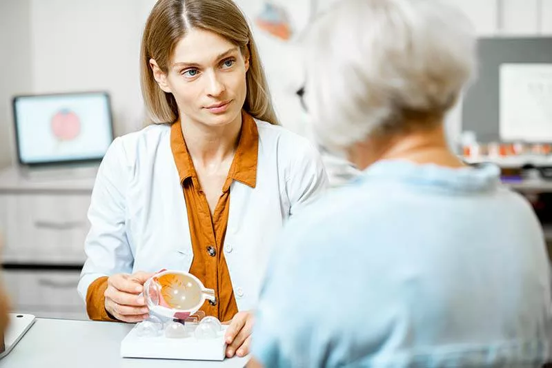 senior women speaking with eye doctor during a cataract surgery consultation