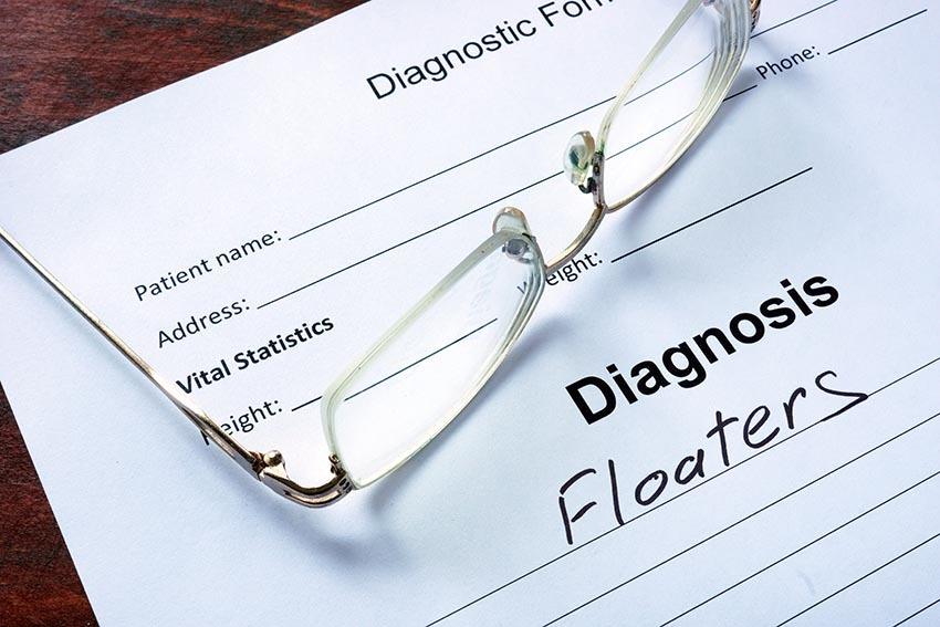 Document containing eye floaters diagnosis information with eyeglasses