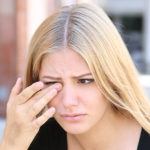 blonde women with eye pain