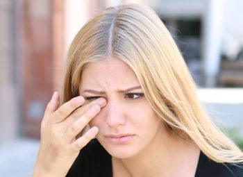 blonde women with eye pain