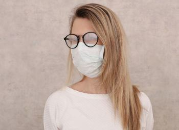 women wearing a face mask with foggy glasses during covid-19