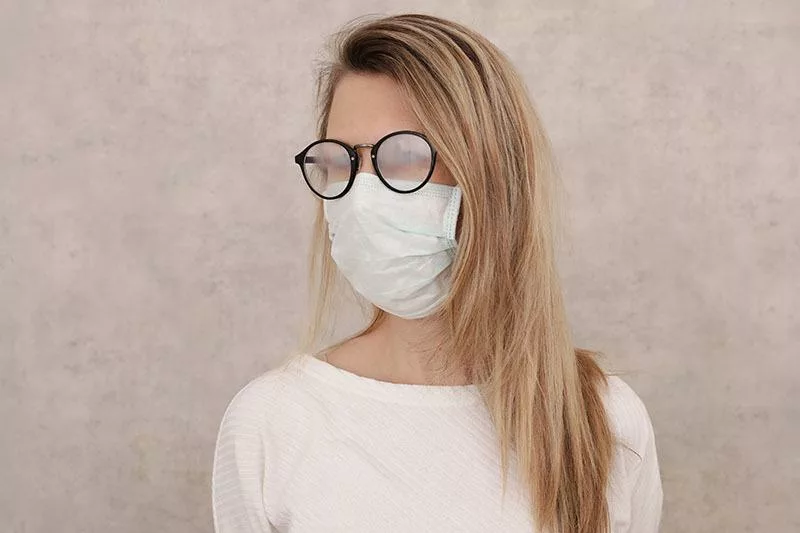 women wearing a face mask with foggy glasses during covid-19