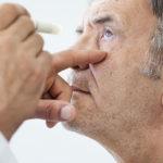 Man gets an eye exam to view the progression of cataracts