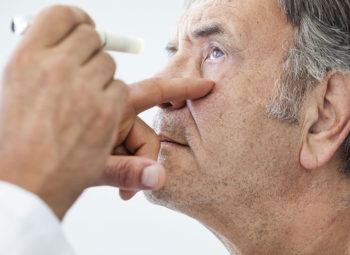 Man gets an eye exam to view the progression of cataracts