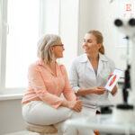 Ophthalmologist explaining something to a patients during an in office consultation