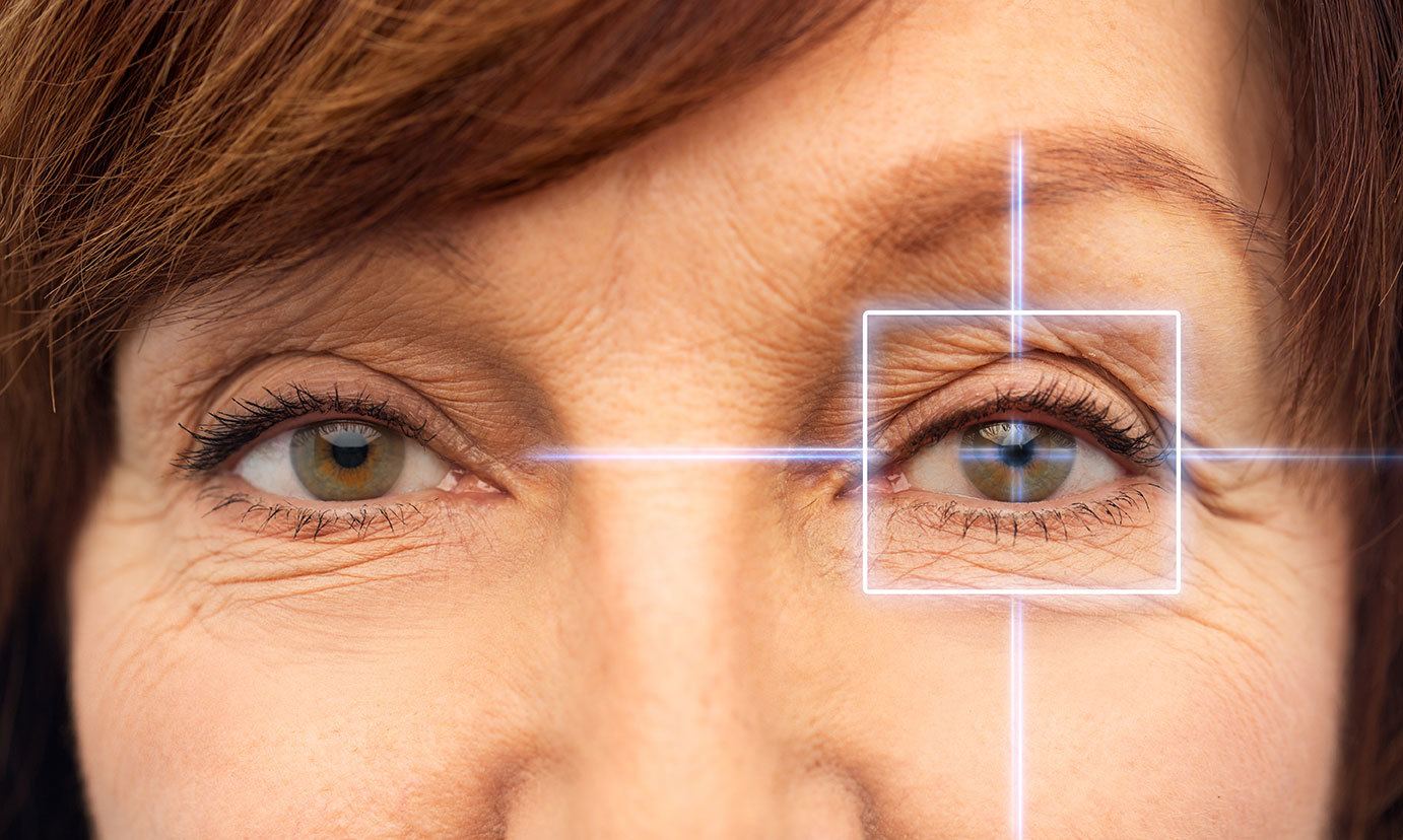 middle-aged woman's eyes with crosshairs over one