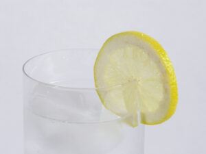 glass of water with lemon wedge